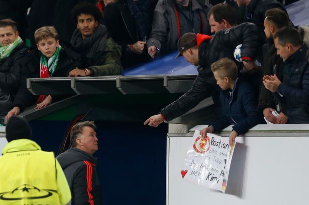 Frustrated: Manchester United manager Louis van Gaal walks down the tunnel at the end of the match as fans gesture