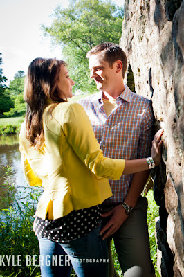 Couple leaning on stone bridge at Fox Hill Park in Bowie, Maryland