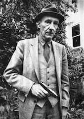 William Burroughs in a Suit Holding a Gun