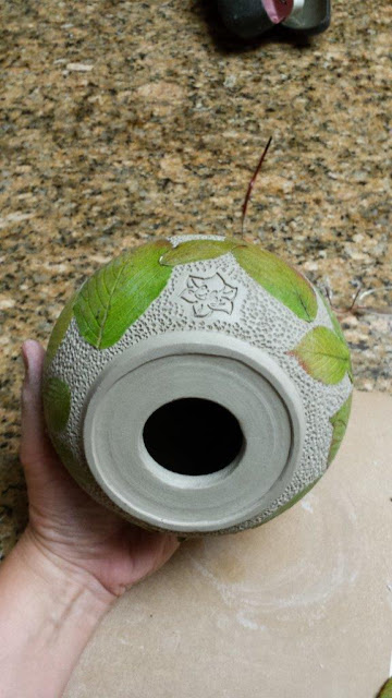 Ceramic pottery vessel by Lily with leaf imprints, in progress.
