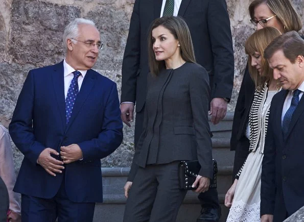 Queen Letizia wore Nina Ricci Pant Suit, Carolina Herrera patent and suede pumps and carried Uterque Studded messenger bag