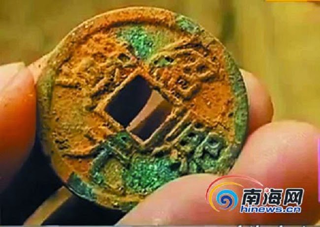 Centuries-old coins excavated in farmer's field