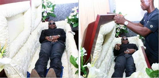 charly boy inside casket