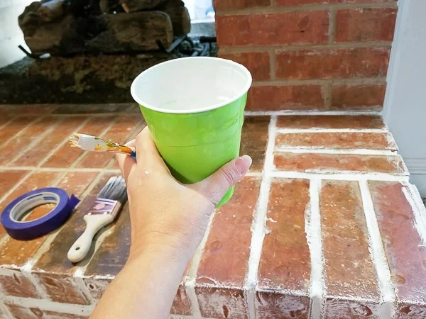Solo cup filled with white chalk paint
