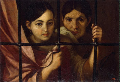 Deux femmes derrière une grille