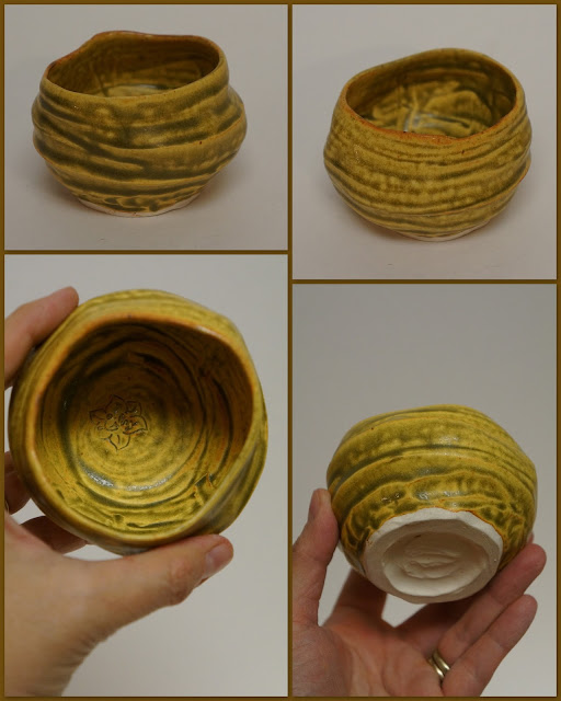 Ceramic pottery wabi-sabi guinomi or tea cup finished in ash yellow glaze.