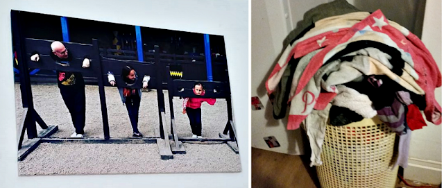 A canvas of my family on the wall and a full washing basket.