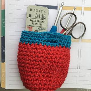 Red and blue crochet storage basket