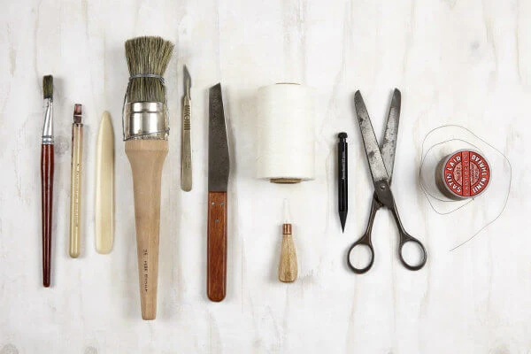 flat lay of ten bookmaking tools