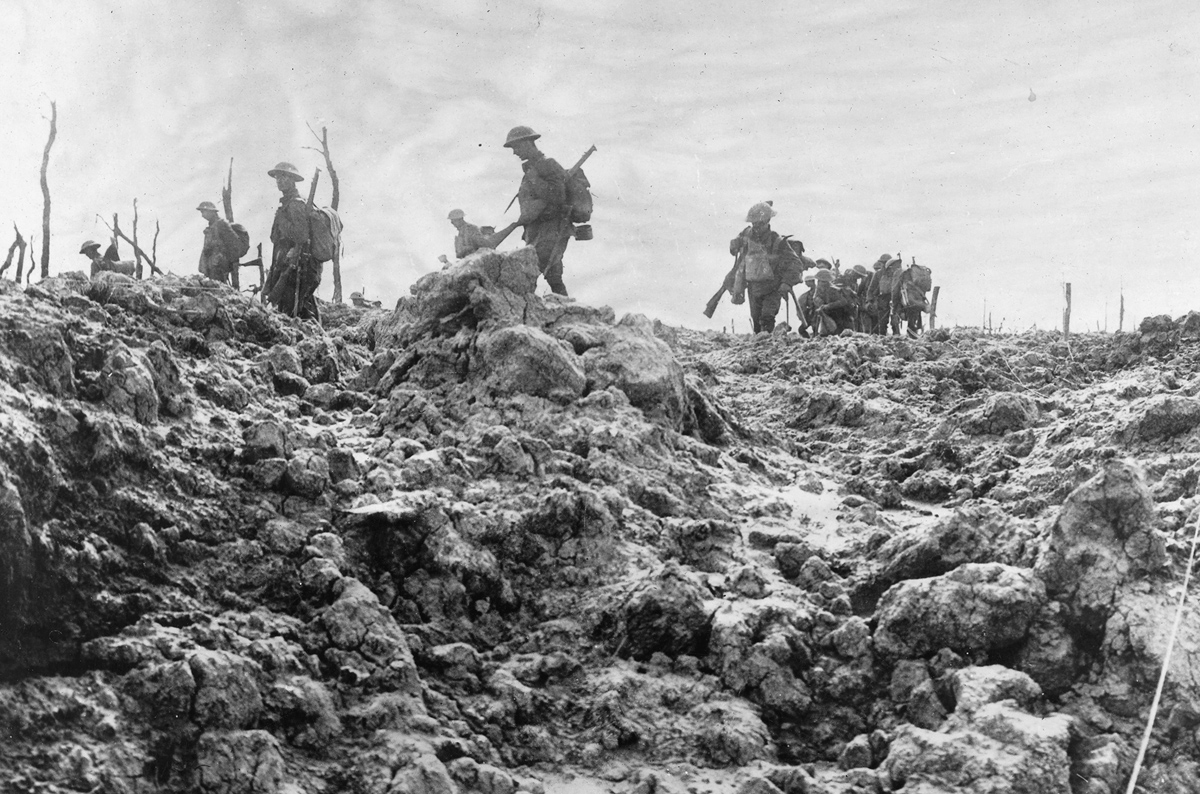 Original caption: Advancing over No Man's Land. Troops moving forward over ground that has been thoroughly churned up by shells from big guns, July, 1918.