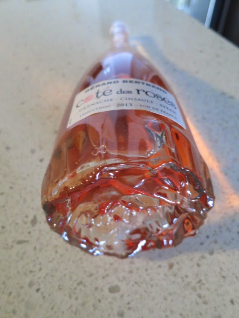 Rose design on bottom of bottle