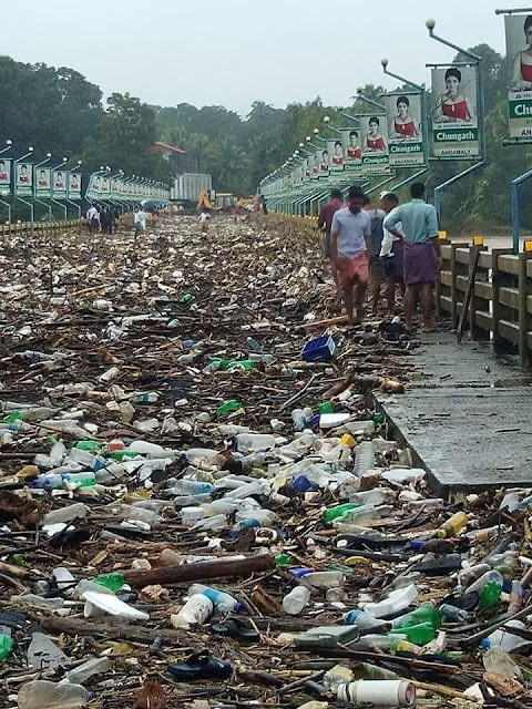 Flooded river waste and debris deposits on Bridge,Kerala floods