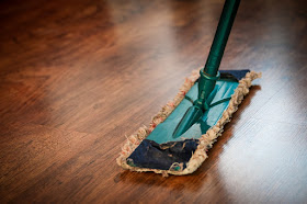 Close up of mop on wooden floor, cleaning, clean