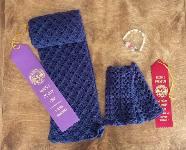 crochet scarf, fingerless gloves, and medical ID bracelet