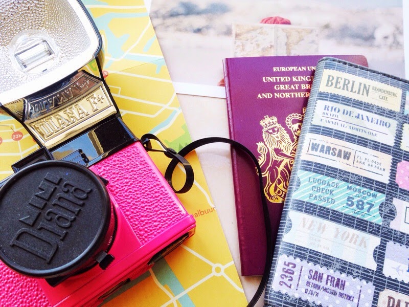 Passport and camera at the ready to travel