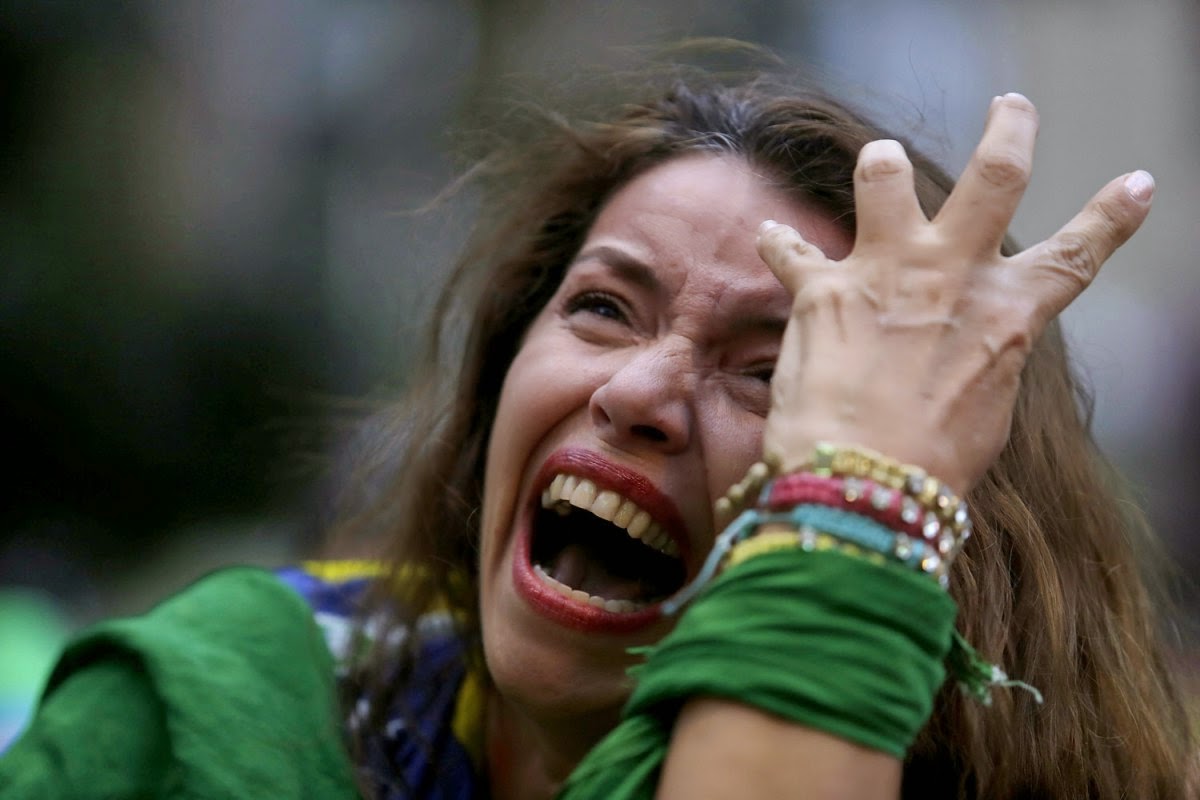 Crying Brazilian fun after Brazil lost semifinal world cup 2014