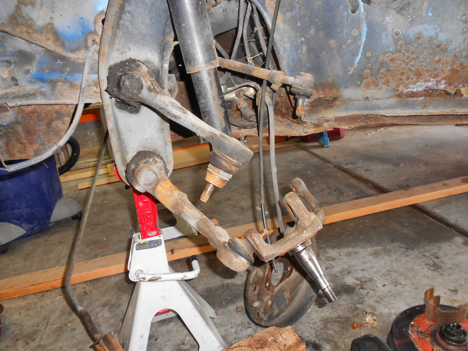 The Bug Boys Installing ball joints and raised spindles in the bug.