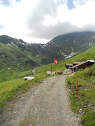 North Face Trail Mürren - Swiss flag on a dirt road