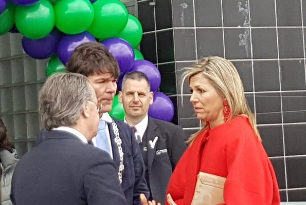 Queen Maxima wore a red top by Natan, and a Natan red wool coat at The Money Wise Platform