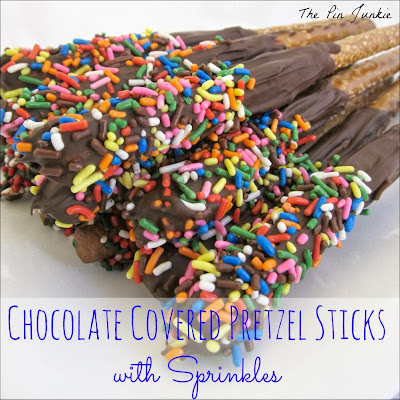 chocolate covered pretzel sticks with sprinkles