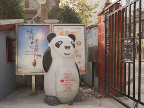 large clothes recycling bin in the shape of a panda in Shanghai