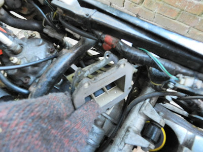 Aprilia RS 125 removing the carb inlet manifold and reeds and checking piston