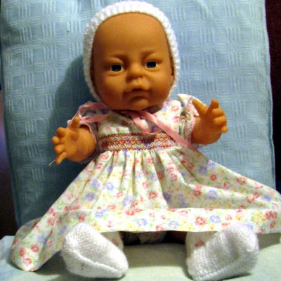 Newborn dressing doll baby