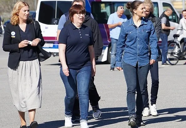 Crown Princess met players and coaches of para football club of IFK Östersund. Adidas Terrex hiking shoes, Levis denim shirt