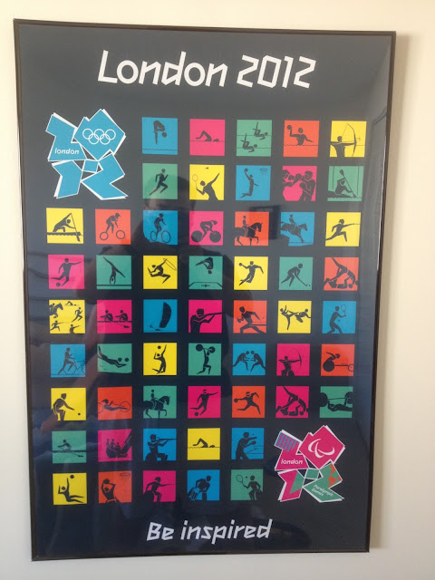 Poster from the London 2012 Olympics.  A collage of the pictrograms that represent the Olympic spots, along with the London 2012 logo, and the games' slogan, "Be Inspired."