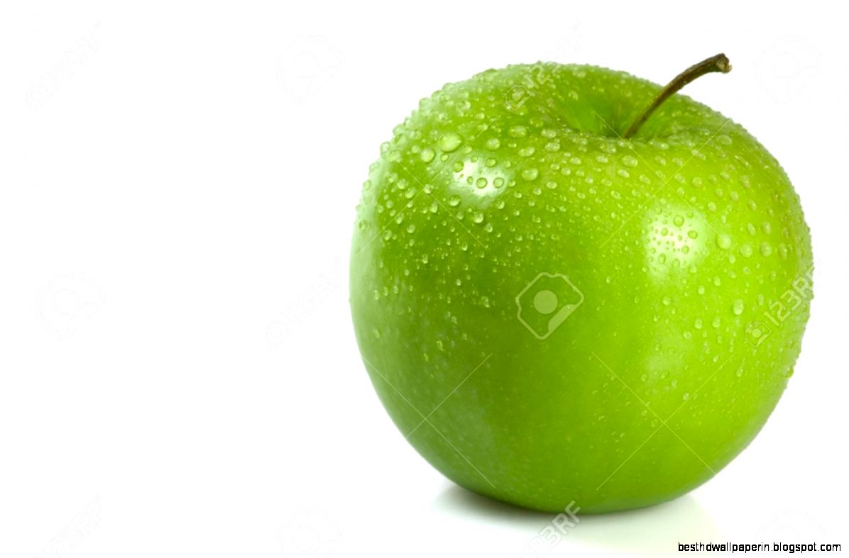 Green Apple Covered In Water Droplets Isolated Against A White