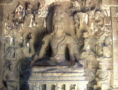 Shiva seated on a throne in a yogic posture, surrounded by gods riding their animal mounts. Ellora, 7th century AD.