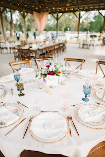 table setting with floral centerpieces