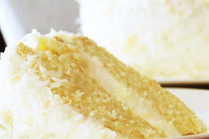 COCONUT CREAM CAKE WITH COCONUT CREAM CHEESE FROSTING