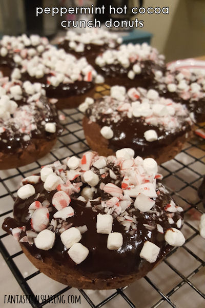 Peppermint Hot Cocoa Crunch Donuts // Why not enjoy a little sweet breakfast with candy canes, chocolate, and marshmallows?! #recipe #peppermint #hotcocoa #chocolate #donuts #marshmallow #breakfast