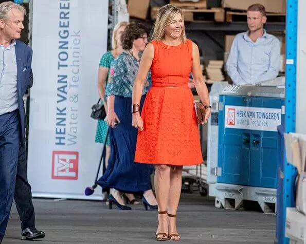 Queen Maxima wore a Natan summer dress in orange. The Queen visited technology facility TechnoHUB in Woerden