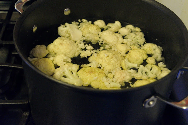 Cauliflower cooking in the boiling water. 