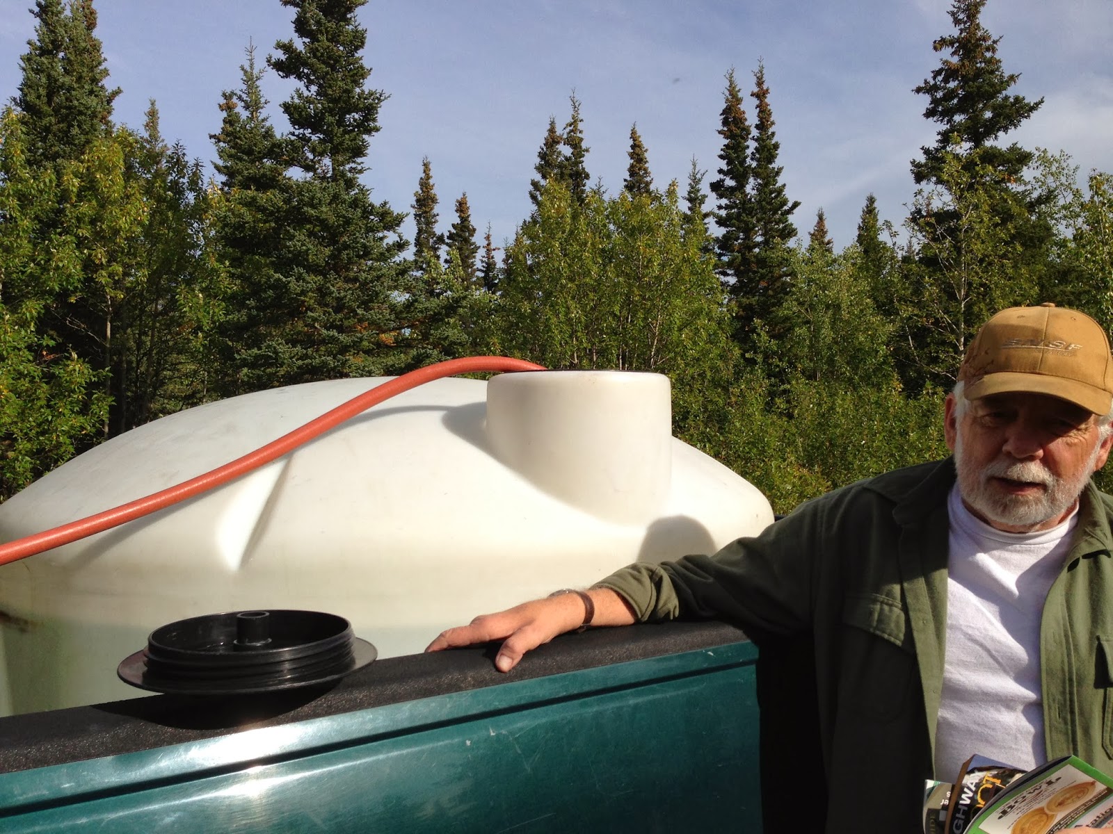 Rural Alaska Hauling Drinking Water From A Local Pump House From