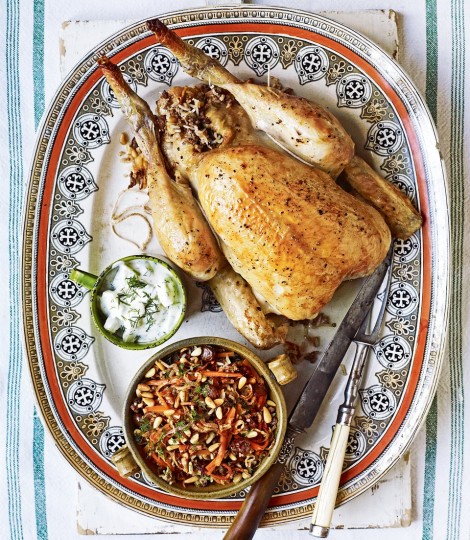 Lebanese roast chicken stuffed with rice, lamb and cinnamon in platter