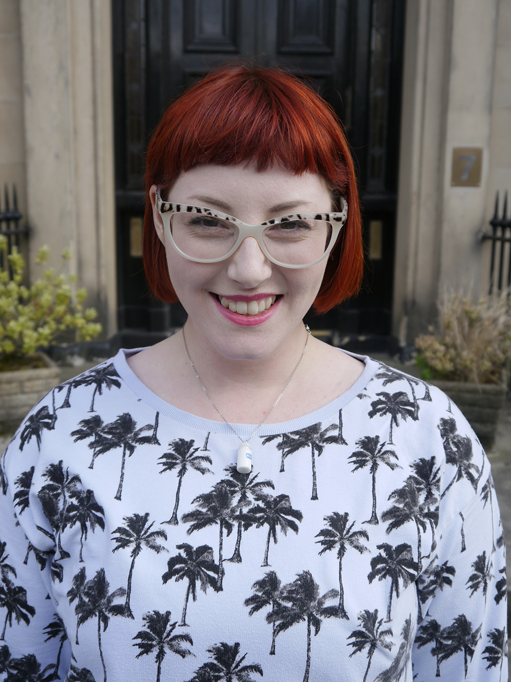 Milk Themed Outfit Scottish blogger, Edinburgh blogger, Scottish street style, quirky street style, dressing to a theme, food inspired outfit, pale girl style, Spex Pistols glasses, red head, red hair, H&M, patterned jumper, palm tree sweatshirt, white pleated dress, white boots, lace up shoes, milk necklace, Tiny Treat Boutique necklace, milk bottle jewellery, Lucky Dip Club
