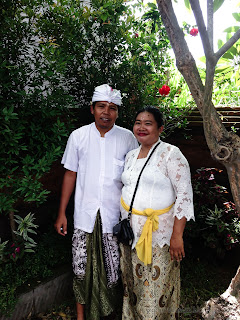 Husband And Wife With Balinese Custome In The Garden Of The Temple During Galungan Ceremony At Dalem Temple Ringdikit