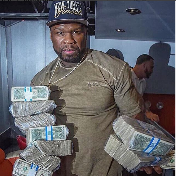 50 Cent displays wad of dollar bills 50 Cent displays wad of dollar bills