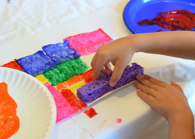 Fit-It-Together Sponge Painting. Great process art activity to explore square and rectangle shapes! Preschoolers, kindergartners, and elementary kids will work on spatial skills while making beautiful art!