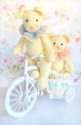 crochet amigurumi bears on a bike