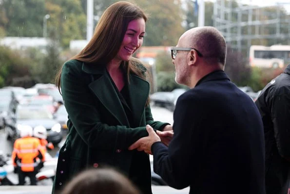 Princess Claire of Luxembourg attended the 11th Indoor Cycling Marathon. Princess Claire wore a green wool coat by Alexander McQueen