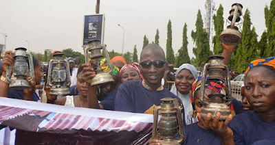 Abuja Residents Storm National Assembly With Lamps Over Lack Of Power Supply Nesi