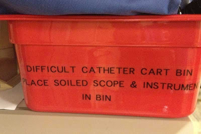 Red bin with sign, Difficult Catheter Cart