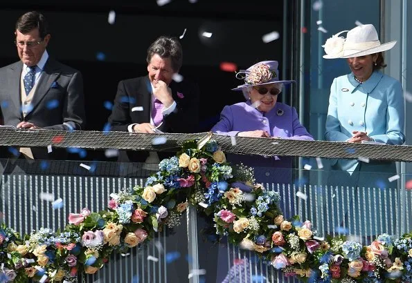 Queen Elizabeth II wore a lilac coat and matching hat, adorned with a broach and floral arrangement for the occasion. actress Dame Helen Mirren, Liz Hurley