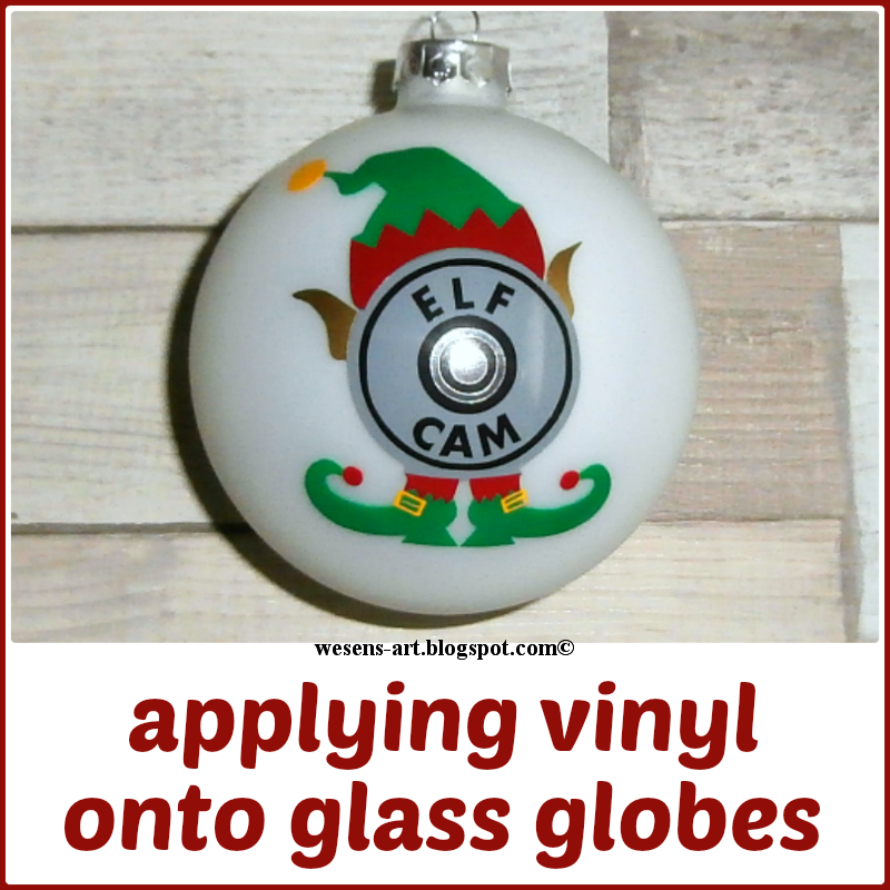 WesensArt applying vinyl onto glass globes