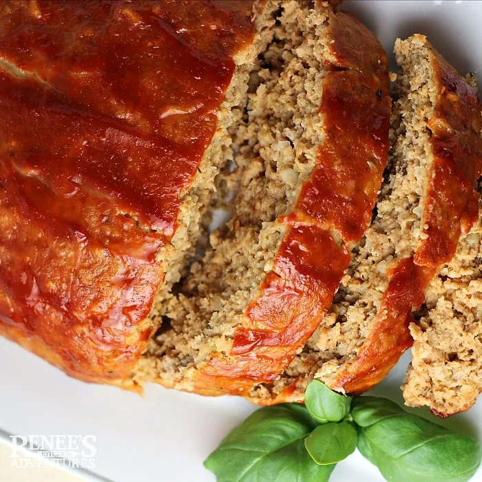 The Best Ground Turkey Meatloaf on platter, sliced from loaf, overhead view