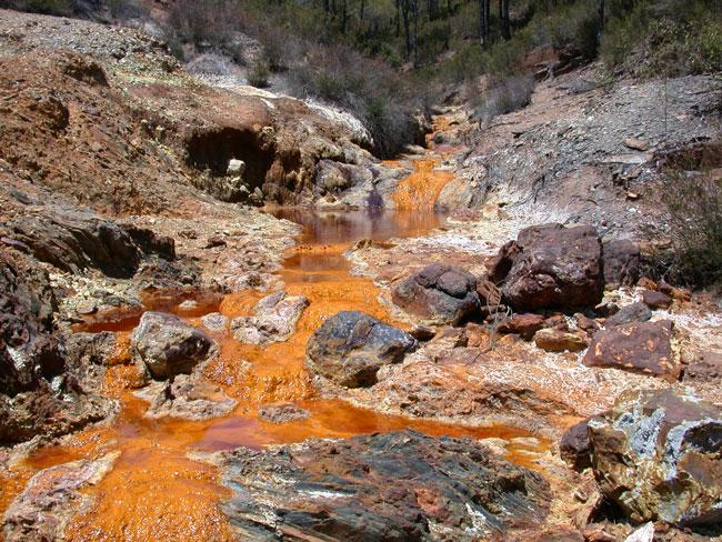 Acid mine drainage causing contamination of water and soils